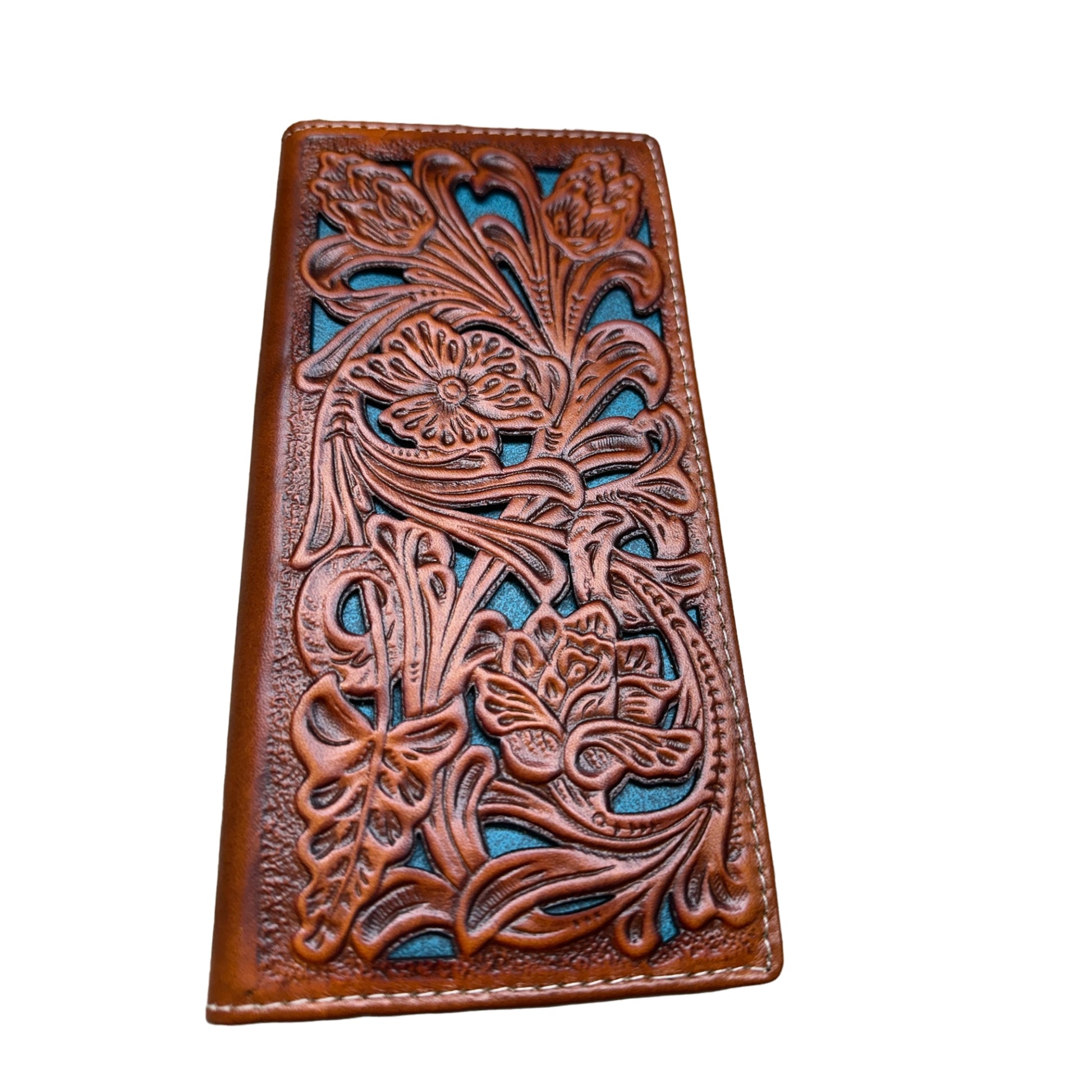 A hand-crafted leather wallet with intricate floral and leaf patterns embossed on the front. The design is detailed, with a blue background peeking through the cutouts. This Floral Leather Long Wallet Brown Teal by Western Stakes is rectangular and photographed against a white background, exuding elegance and quality craftsmanship.