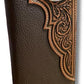 A handcrafted brown coffee leather wallet with intricate embossed designs and a stitched border showcases western charm. This premium Men's Long Wallet Coffee Longhorn Concho by Western Stakes features a detailed, ornate metal emblem with an eagle motif on the upper right corner. The combination of smooth and textured leather adds a rustic, sophisticated look.