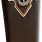 A Western Stakes Mens Leather Long Wallet Longhorn Horseshoe Coffee with intricate embossed designs and a central longhorn horseshoe concho emblem. This brown leather wallet features white stitching around its edges and a tan accent at the top, exuding both rugged style and practicality.