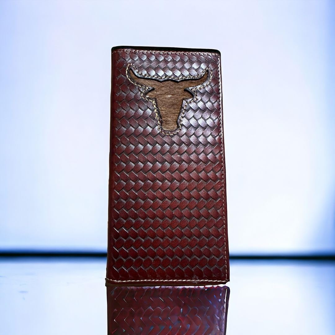 A slim, vertical leather wallet with a dark brown, textured pattern. The front features a hand-tooled longhorn design embossed in a prominent position near the top. The background is a gradient of light blue to white, and the **Western Stakes Longhorn Long Wallet Brown Basketweave W/ Cow Hair** is reflected on the shiny surface it stands on.