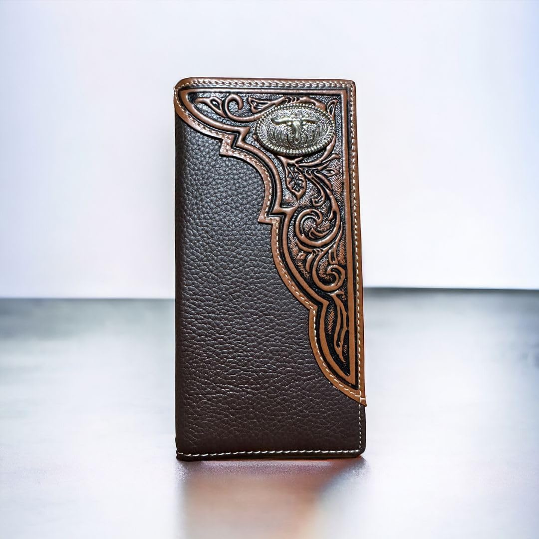 A brown coffee leather wallet stands upright on a light surface. It features detailed carvings on the right edge and a small, ornate metal emblem with a raised buffalo figure near the top. This premium Mens Long Wallet Coffee Longhorn Concho by Western Stakes embodies intricate patterns and stitching details, exuding western charm from every angle.