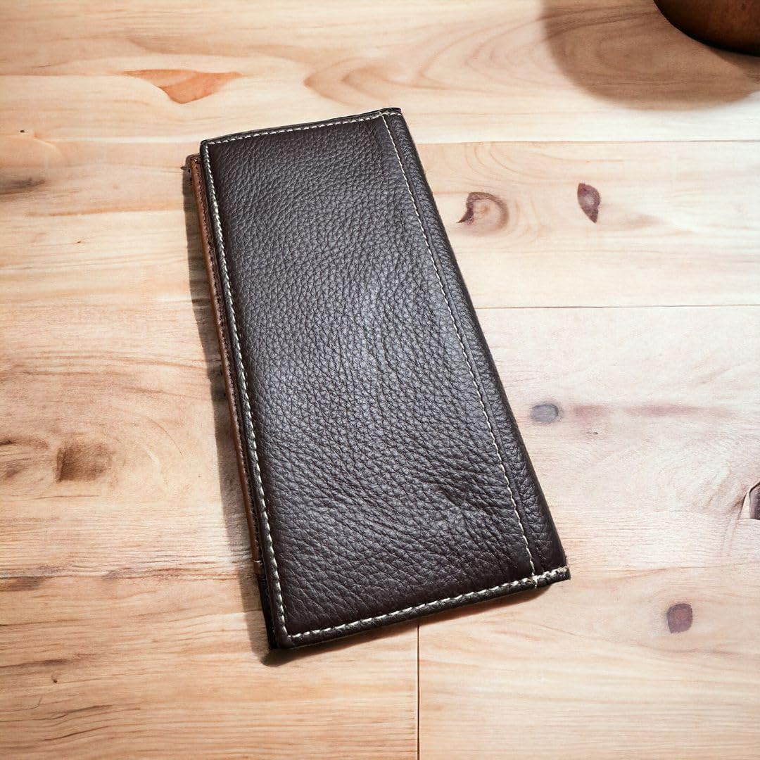 A rectangular, brown leather Floral Long Wallet Coffee Star Concho by Western Stakes with visible stitching lies closed on a wooden surface. The texture of the leather is slightly pebbled, and the wallet's design is simple and classic—an ideal gift for him.