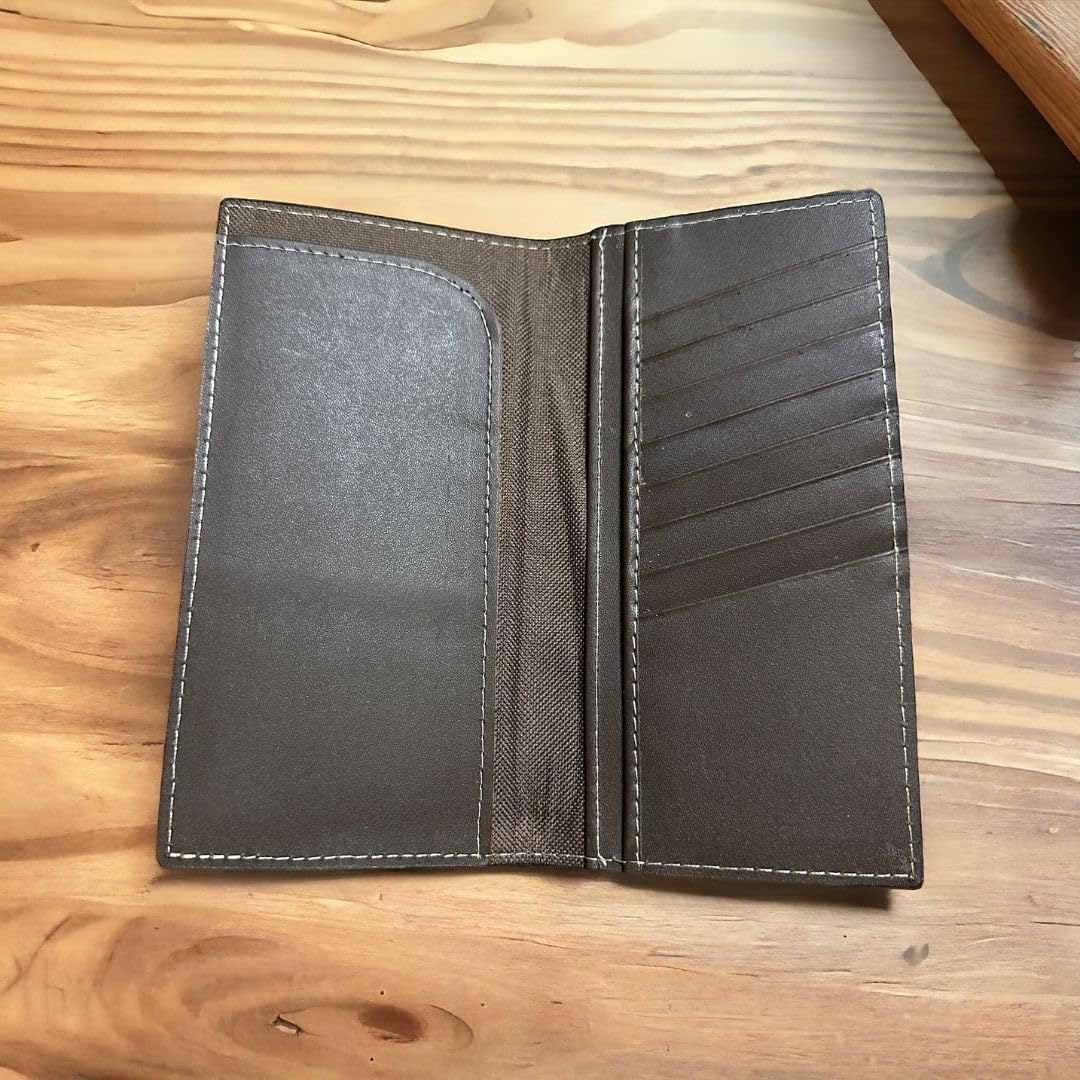 An open high-end brown leather wallet laid flat on a wooden surface, showcasing its interior sections. The left side features a large pocket in a checkbook style, and the right side contains several vertical card slots. The stitching around the edges is visible, highlighting its Western Stakes Horseshoe Long Wallet Coffee Red Trim W Cowhair design.