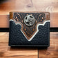 A **Western Stakes Mens Leather Wallet Texas Star Concho Black** with intricate brown and white detailing is displayed on a wooden surface. The wallet features ornate patterns on the top flap, and an elaborate Texas Star Concho adds a decorative touch in the center, giving it a distinctive Western flair.