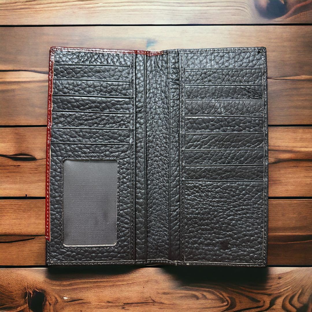 A Western Stakes Horse Horseshoe Long Wallet in Coffee Red Tint is open on a wooden surface, showcasing multiple card slots, a transparent ID window, and large compartments for bills. The texture of the leather is visible, emphasizing its rugged and durable appearance, ideal for those seeking a spacious checkbook style.