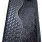 A Western Stakes Bull Rider Long Wallet W Cowhair Basketweave with intricate woven and tooled patterns, perfect as a cowboy accessory. The wallet features a textured, hair-on-hide panel and a decorative silver emblem on the upper right corner. White stitching outlines the edges, creating a stylish finish worthy of any bull rider.